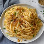Caramelized Onion Pasta are combined in a pan, creating a flavorful and comforting dish.