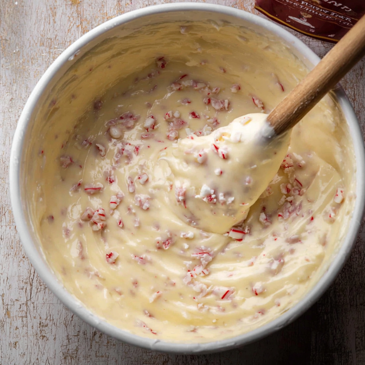 Scrape down the sides and gently fold in the Andes peppermint chips with a spatula.